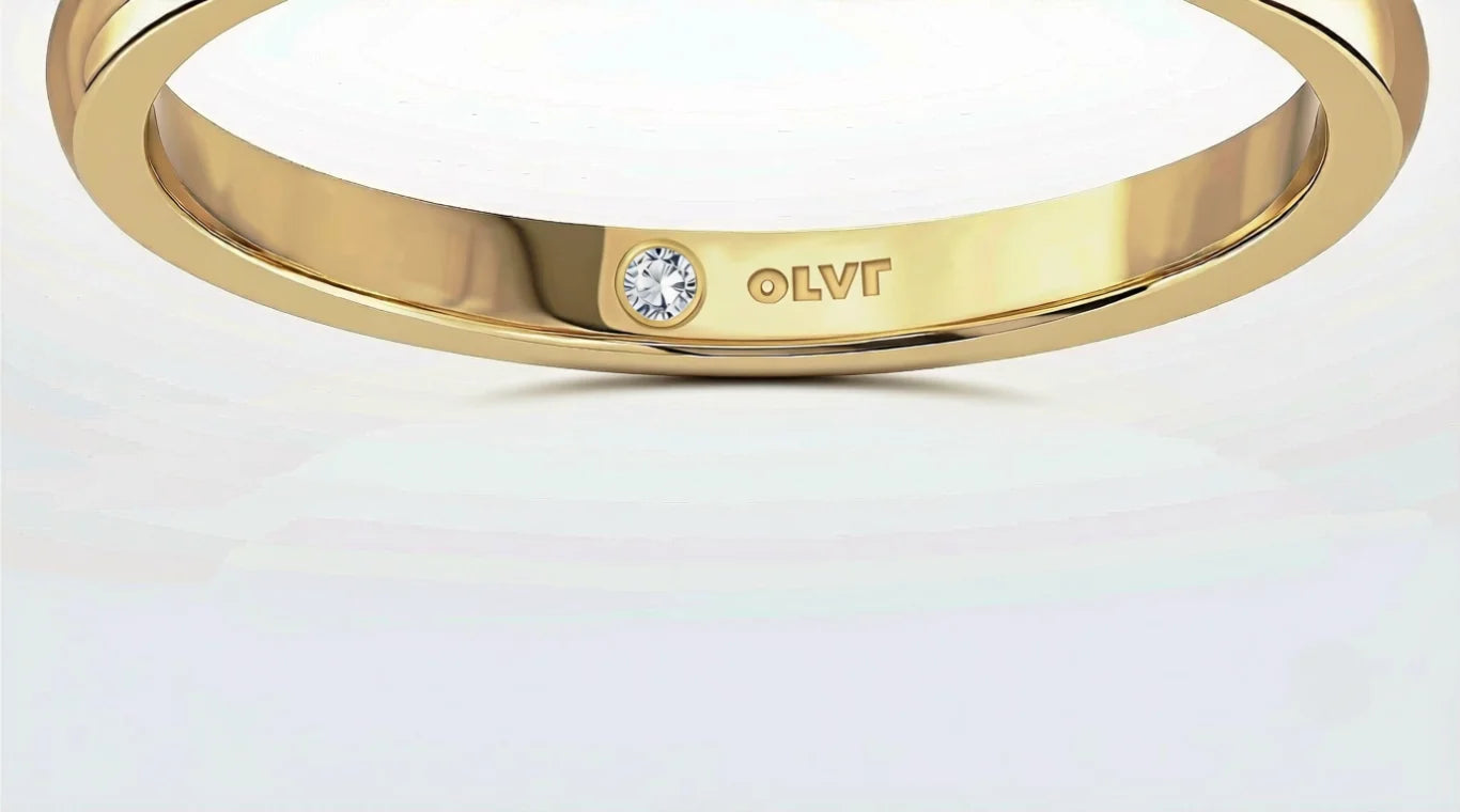 The inside of an OLVR band, engraved, with a stone set beside the engraving